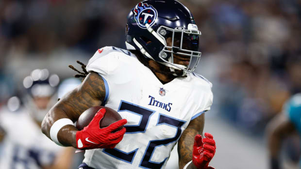 Jan 7, 2023; Jacksonville, Florida, USA; Tennessee Titans running back Derrick Henry (22) runs the ball against the Jacksonville Jaguars during the first quarter at TIAA Bank Field. Mandatory Credit: Douglas DeFelice-USA TODAY Sports  